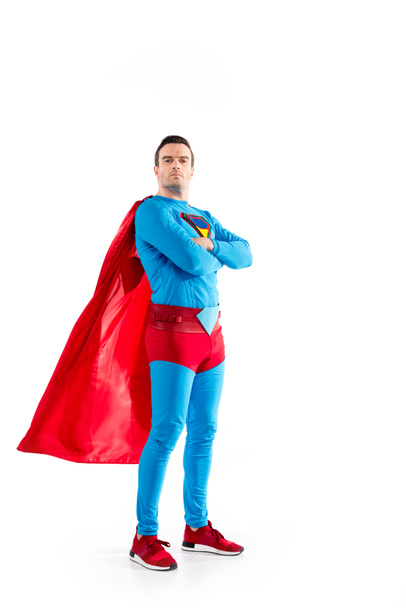 full length view of confident superman standing with crossed arms and looking at camera isolated on white  - Фото, зображення