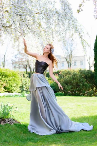 young woman in beautiful dress outdoor  - Foto, Imagen