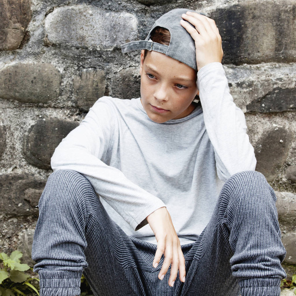 Sad teen outdoors. Unhappy teenager. Abuse - Photo, Image