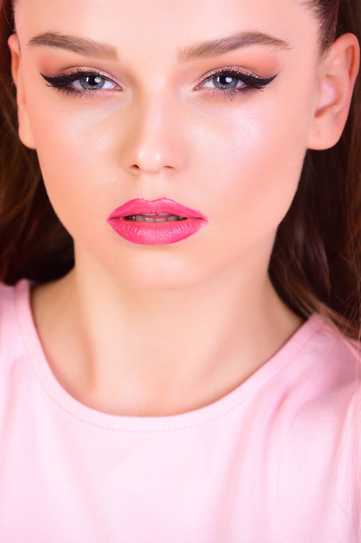 sensual woman with long hair on pink background. sensual woman with makeup on pretty face - Valokuva, kuva