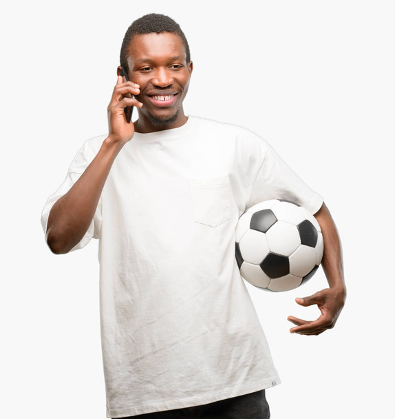 African black m happy talking using a smartphone mobile phone - Фото, изображение
