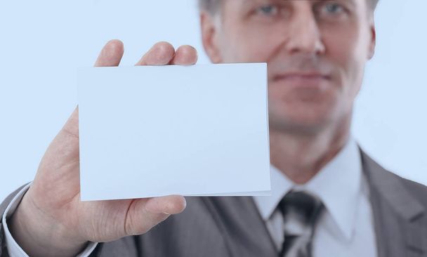 serious businessman showing blank business card - Photo, image