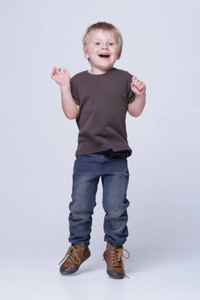 Studio portrait of a cute smiling boy in studio. Happy child. - Foto, Imagem