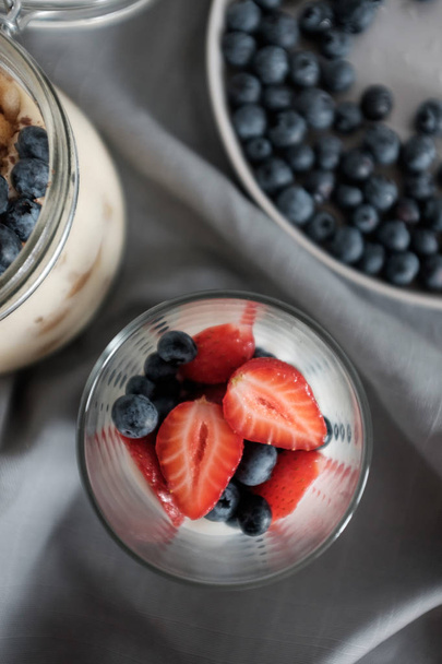 Healthy breakfast with blueberries and strawberries - Photo, image