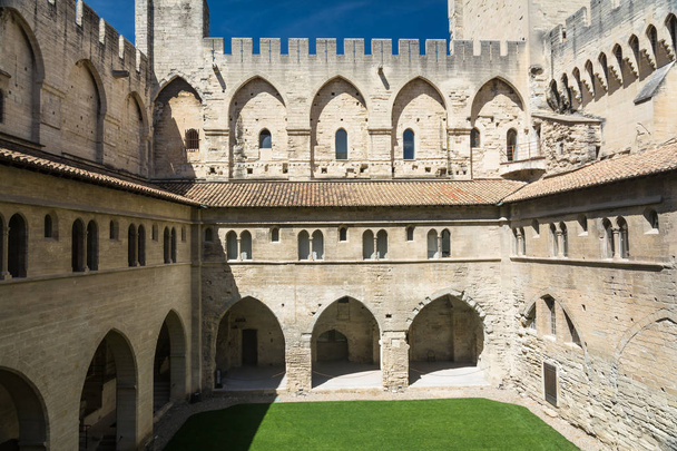 Avignon,France-august 12,2016:torist visit the Palace of the Popes, famous christian landmark in France and Unesco heritage site during a sunny day - 写真・画像