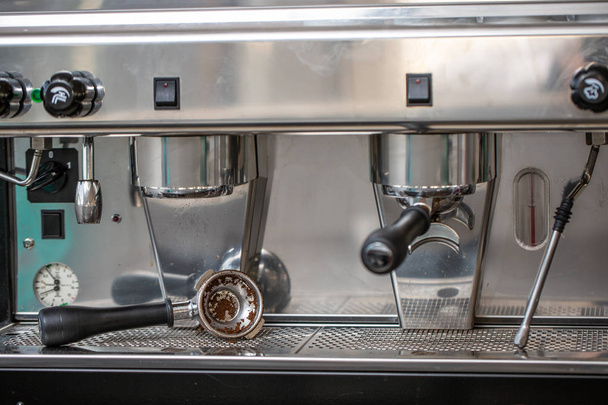 Dirty coffee portafilter. Coffee machine after use at the restaurant - 写真・画像