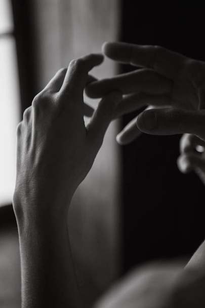 woman's hands touching her fingers room - Valokuva, kuva