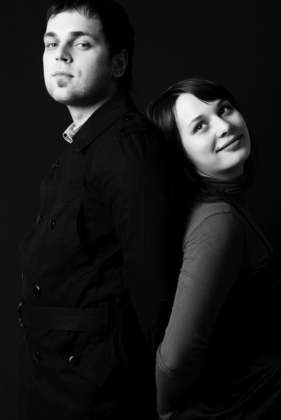 Serious man and a dreamy young woman - Fotó, kép