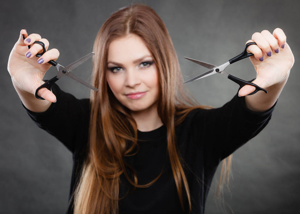 Elegance and classy. Fashion style of hairdo. Female professionalist with scissors. Elegant woman presents her hairdresser's saloon. - Photo, image