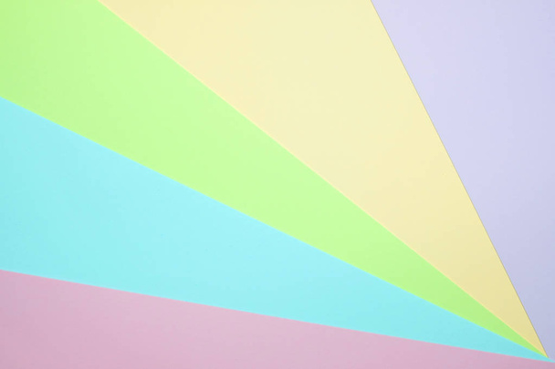 Fashionable  pastel colored paper flat lay top view, geometric background texture, pink, purple, yellow, beige, green and blue colour. - Fotó, kép