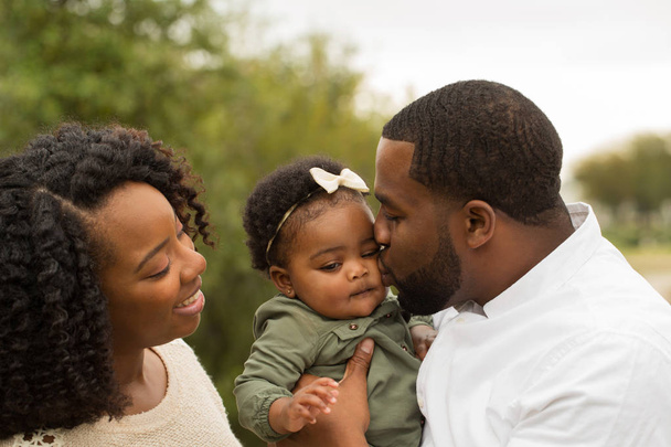 Happy African American family with their baby. - Фото, зображення