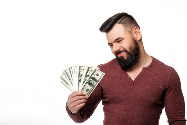 man with beard holding money dollar bills - Valokuva, kuva
