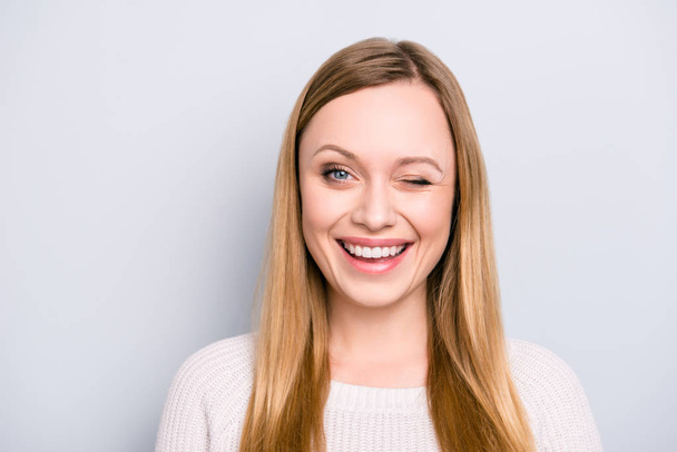 Head shot portrait of charming pretty laughter lovely girl in good mood winking with one eye isolated on grey background - Photo, Image