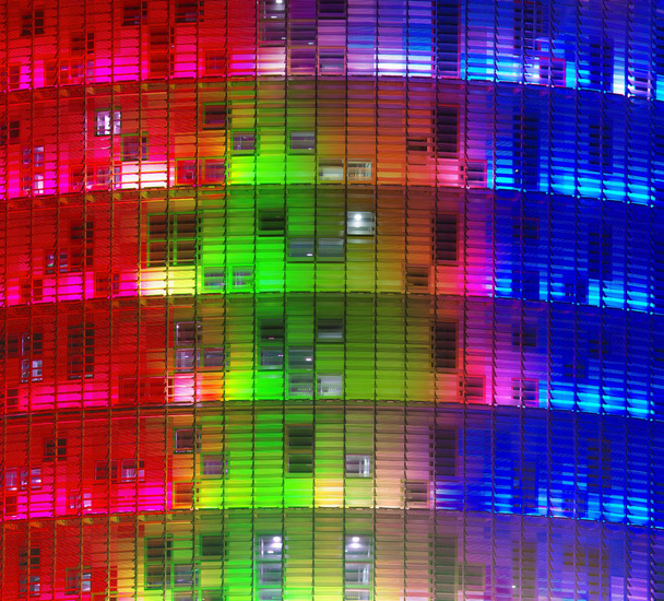 modern office building at night illuminated in colors - Zdjęcie, obraz