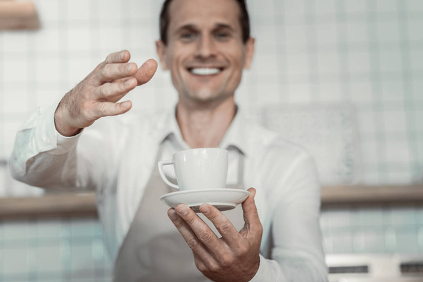 Focused photo on male hands that demonstrating new coffee - Fotó, kép