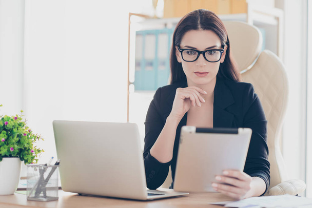 Portrait of successful attorney hardworking financier attractive smart woman in glasses using tablet wi-fi internet, teleworking concept, sitting at work place - Foto, afbeelding