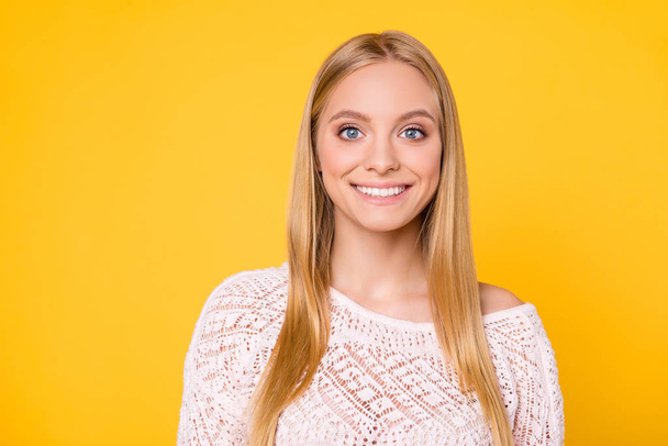 Portrait of positive nice girl in sexy outfit looking at camera isolated on yellow background - Valokuva, kuva