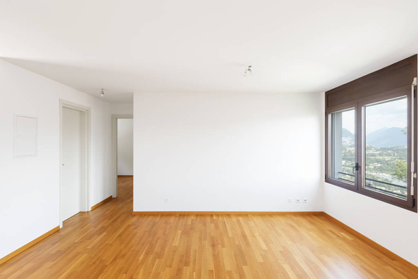 White empty room with parquet in modern apartment. Large windows overlooking the lake and no one inside - Photo, image