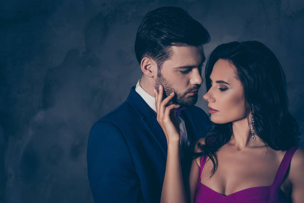 Portrait of naughty romantic couple looking at each other gentle touch, pretty charming brunette lady harsh bearded hispanic gentlemen isolated on grey background with copy space. Intimacy concept - Fotografie, Obrázek