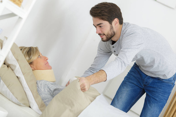 woman being assisted at home - Photo, image