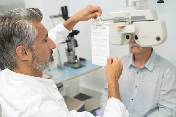 adult male doctor near with ophthalmic equipment - Foto, Imagem