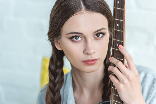 attractive caucasian teen girl with electric guitar   - Photo, Image