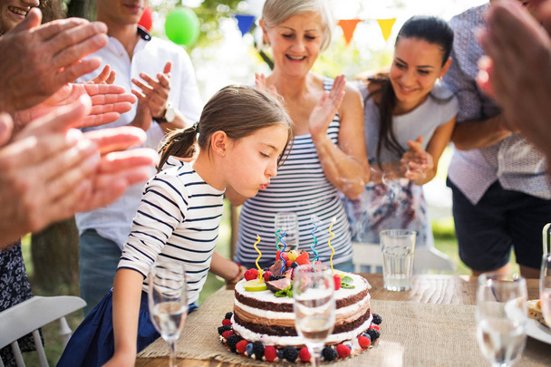 Family celebration or a garden party outside in the backyard. - Photo, image