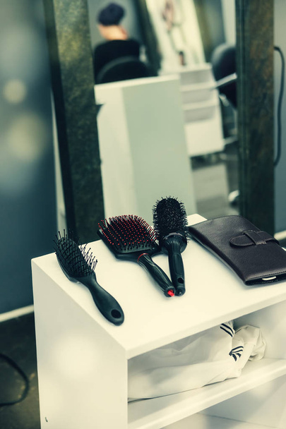 Professional beautician hairdressing tools and accessories at beauty salon. Toned image - Photo, Image