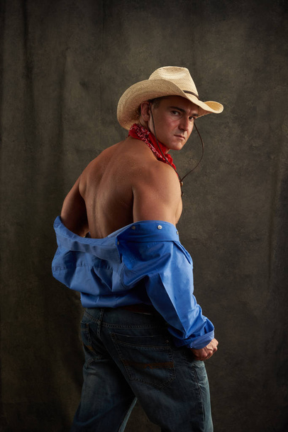 The sexy man is dressed like a cowboy. - Photo, Image