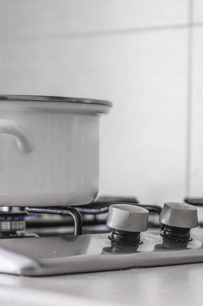 pot stands on a gas stove - Foto, Imagen