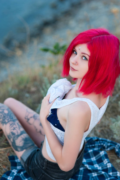 Portrait of a young sexy alternative emo girl model with bright pink hair - Photo, Image