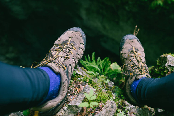 Closeup of hiking shoes. National Park of Slovensky raj, situated in the eastern part of Slovakia contains one of the biggest ice caves in Europe and an attractive landscape of karstic plateaux, gorges, waterfalls and caves - Photo, Image