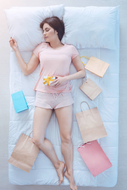 Exhausted lady falling asleep after shopping run - Foto, Imagen