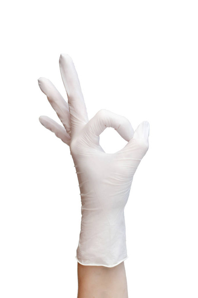 Ok sign  made of white medical gloves. Fingers showing Okay symbol - Фото, изображение