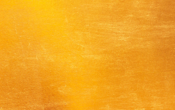 Shiny yellow leaf gold foil texture background - Fotó, kép
