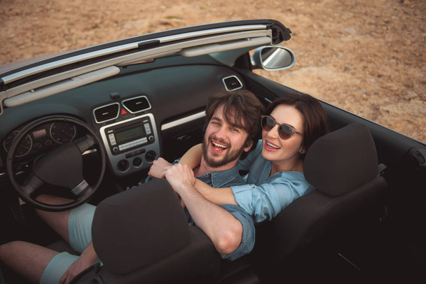 Optimistic boyfriend and girlfriend are enjoying summer vacation - Foto, imagen