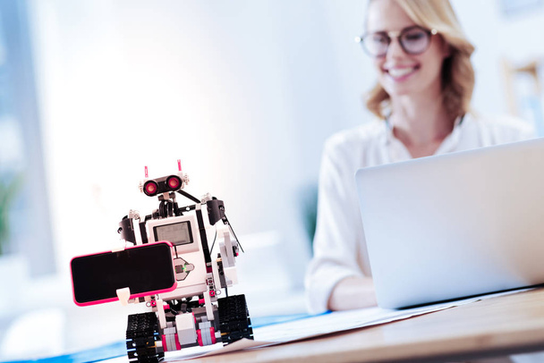 Selective focus of a robot holding smartphone - Photo, image