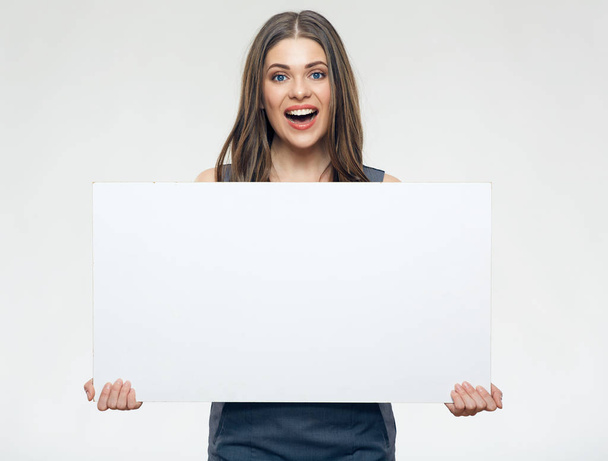Businesswoman holding big empty banner isolated on white background - Zdjęcie, obraz