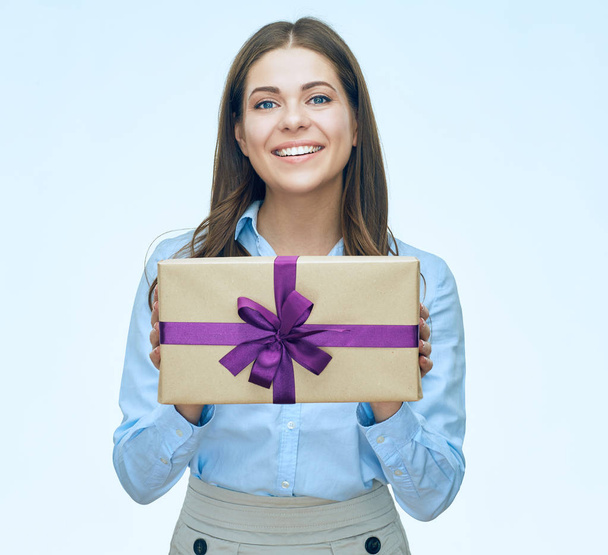 Smiling businesswoman holding gift box isolated on white background - Photo, Image