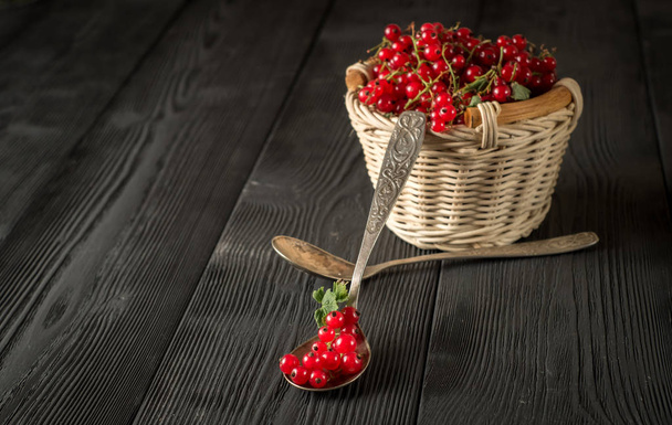 close up red currant berry on black wood boards - 写真・画像