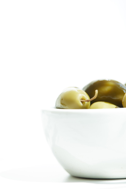close up view of bowl with  green olives isolated on white background - Photo, Image