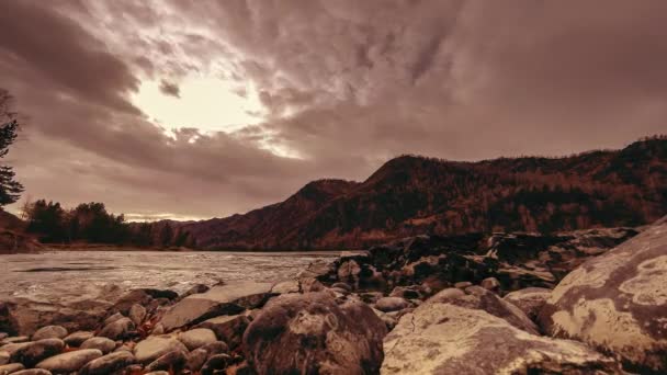 Time lapse shot of a river near mountain forest. Huge rocks and fast clouds movenings. Horizontal slider movement - Video