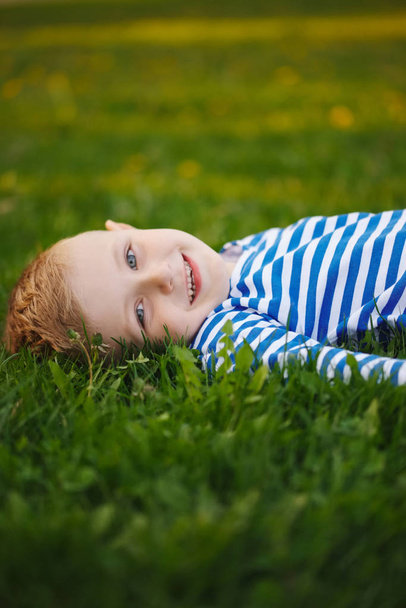 little boy lying on the grass - Fotoğraf, Görsel