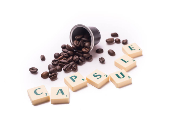 capsule written with scrabble letters on a white background composition - Photo, Image