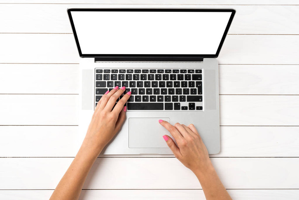 Woman using modern white laptop in office. Top view - Foto, Imagen