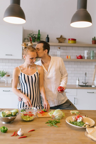 Image of beautiful couple in love preparing breakfast - Foto, Bild