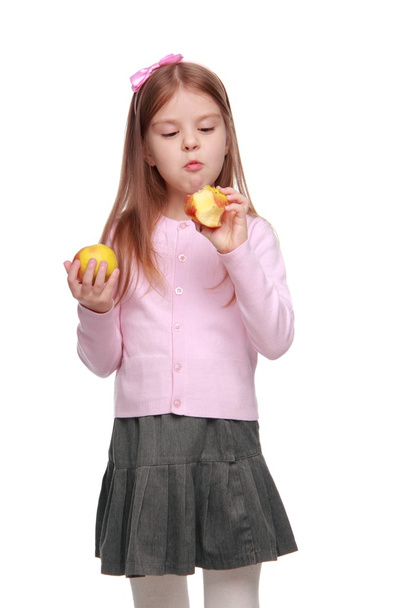 Lovely school girl with apple - Photo, Image