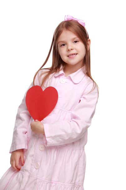 Young girl with heart symbol on St.Valentine holiday theme - Fotó, kép