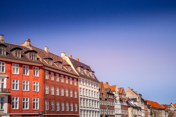 Urban scene with colorful buildings and clear blue sky in Copenhagen, denmark - Photo, Image