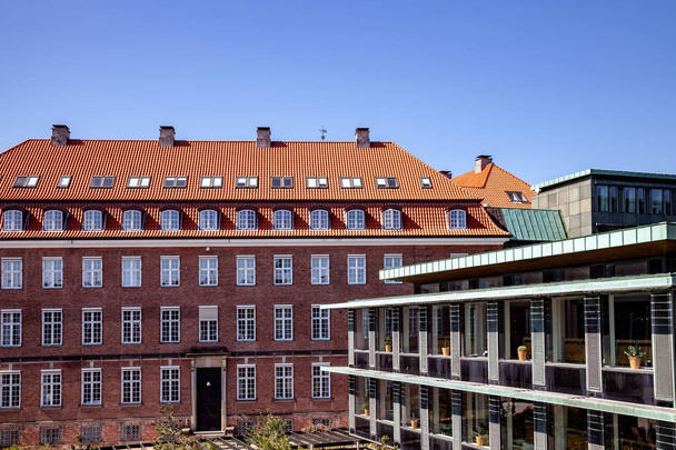 Urban scene with blue sky and buildings in Copenhagen, Denmark - Foto, afbeelding